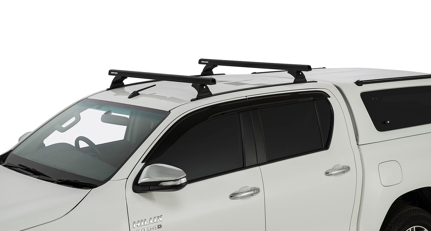 Kit 2 barres de toit noire 1250mm Heavy Duty RCH Trackmount Toyota Hilux Revo 2015+ - RHINO-RACK sur Xperts4x4 Accessoires 4x4 Off-Road