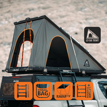 Tente de toit LT-50 Lightweight Alu-Cab en aluminium, déployée sur un véhicule pour camping en plein air.
